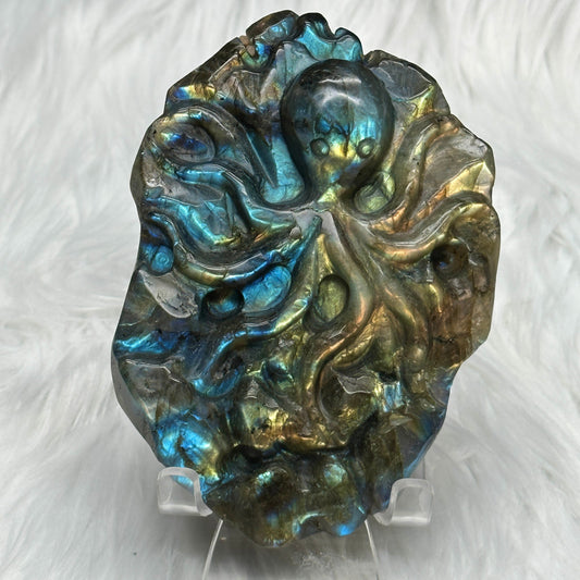 Flashy labradorite hand carved octopus carving with stand.