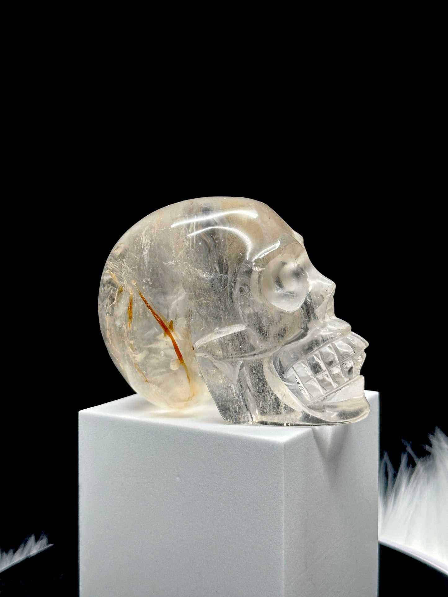 Clear Quartz Crystal Skull with Hematite Inclusion.