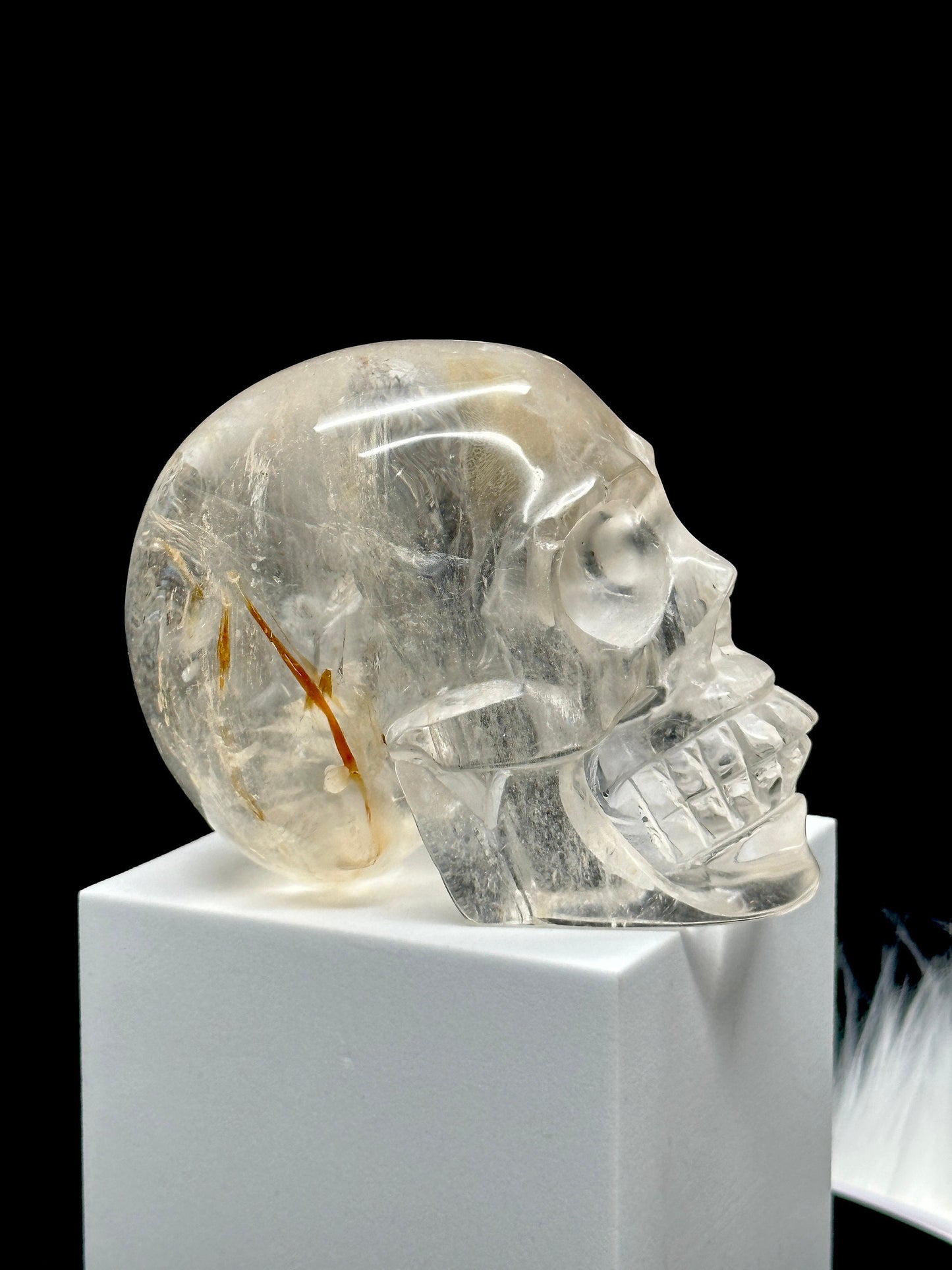 Clear Quartz Crystal Skull with Hematite Inclusion.