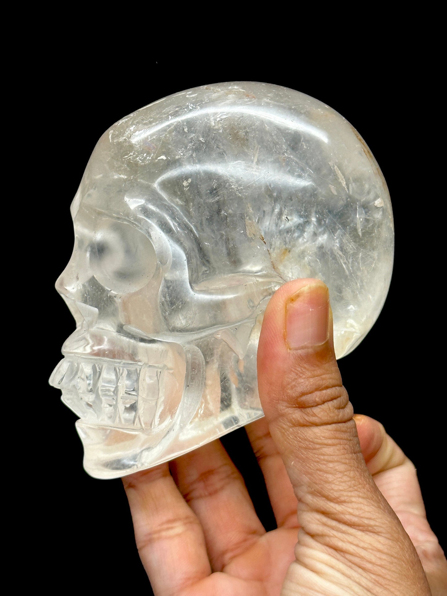 Clear Quartz Crystal Skull with Hematite Inclusion.