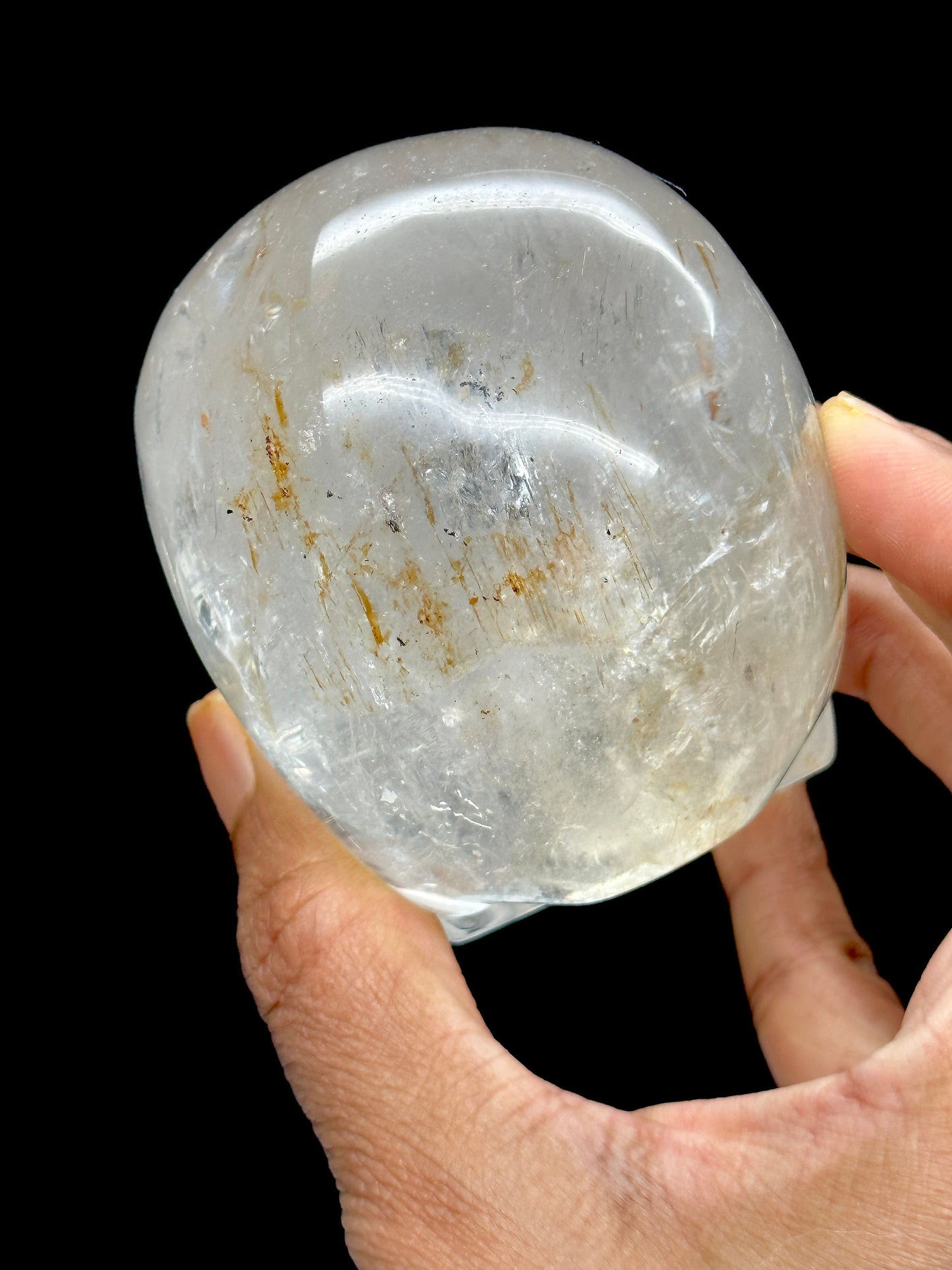 Clear Quartz Crystal Skull with Hematite Inclusion.