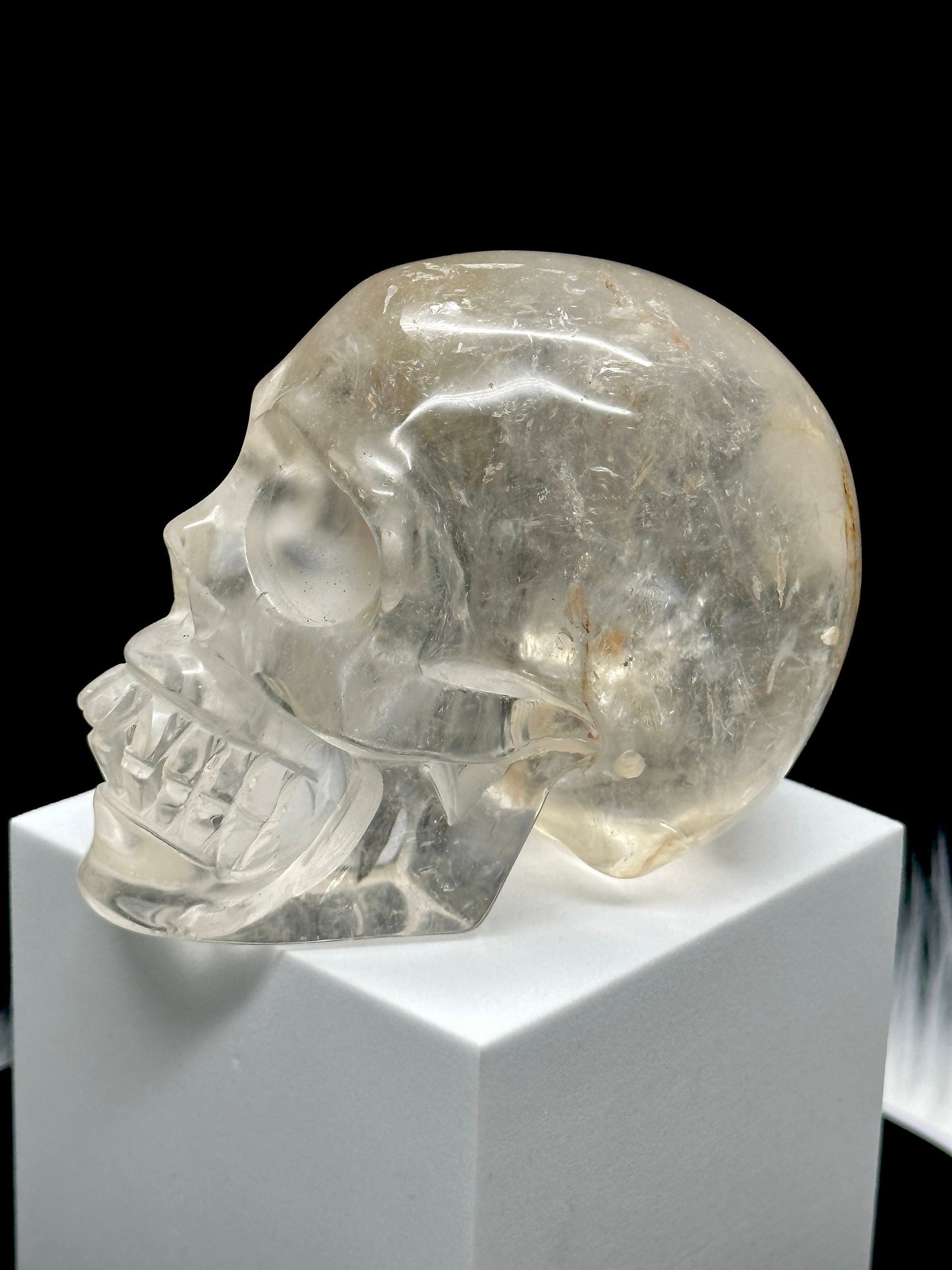 Clear Quartz Crystal Skull with Hematite Inclusion.