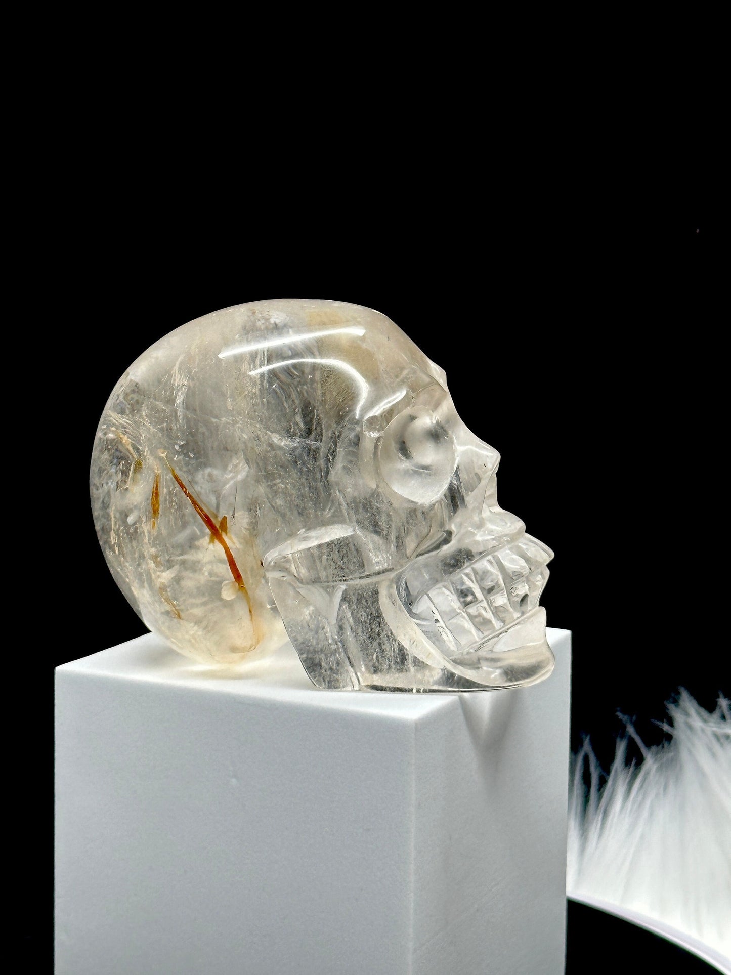 Clear Quartz Crystal Skull with Hematite Inclusion.