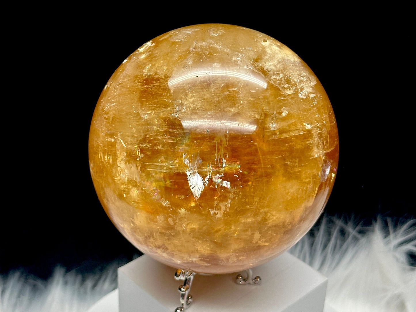 Rainbow filled large honey calcite sphere