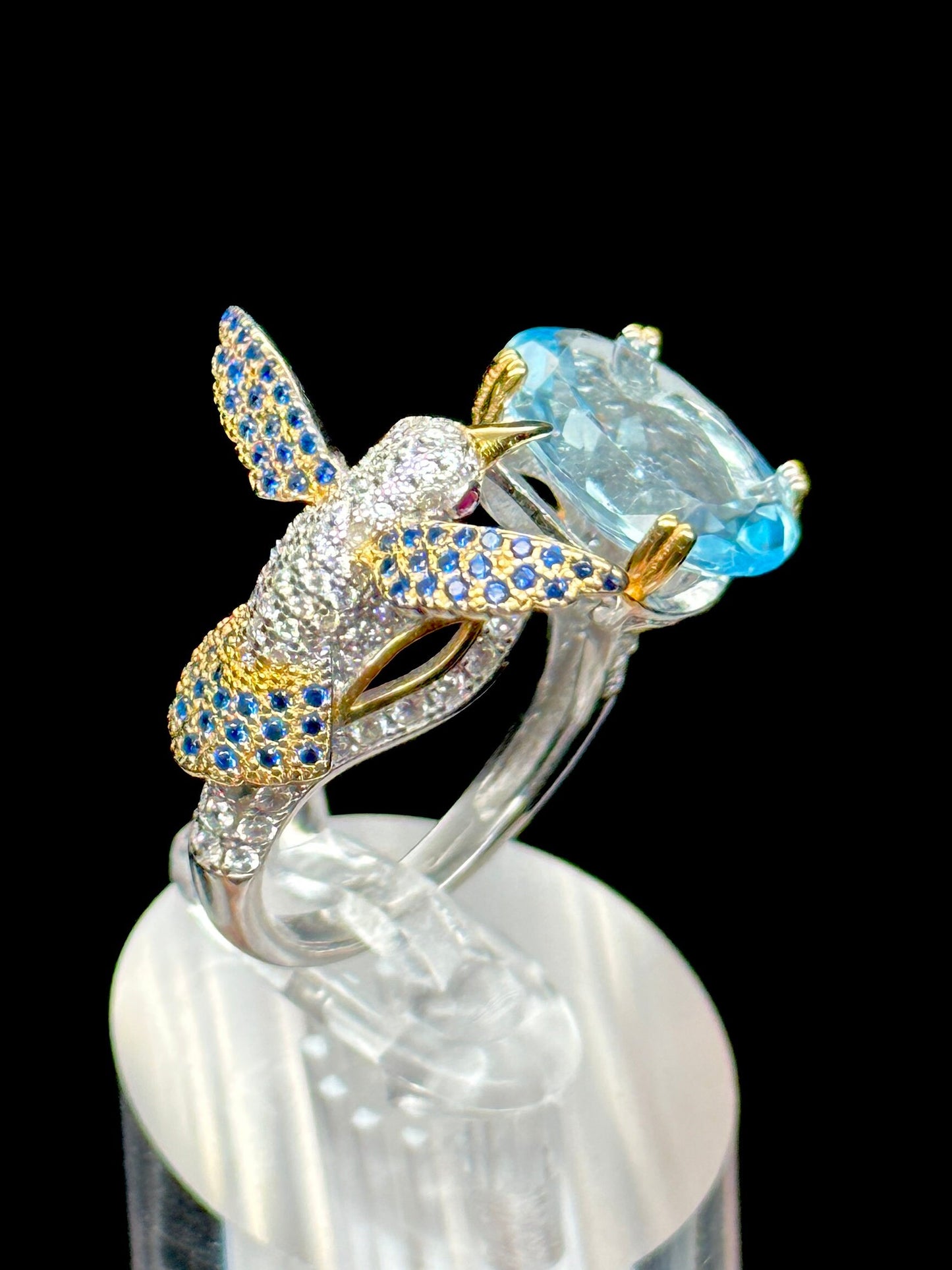 Blue Topaz Ring set in 925 Sterling silver with humming bird design, Adjustable Size