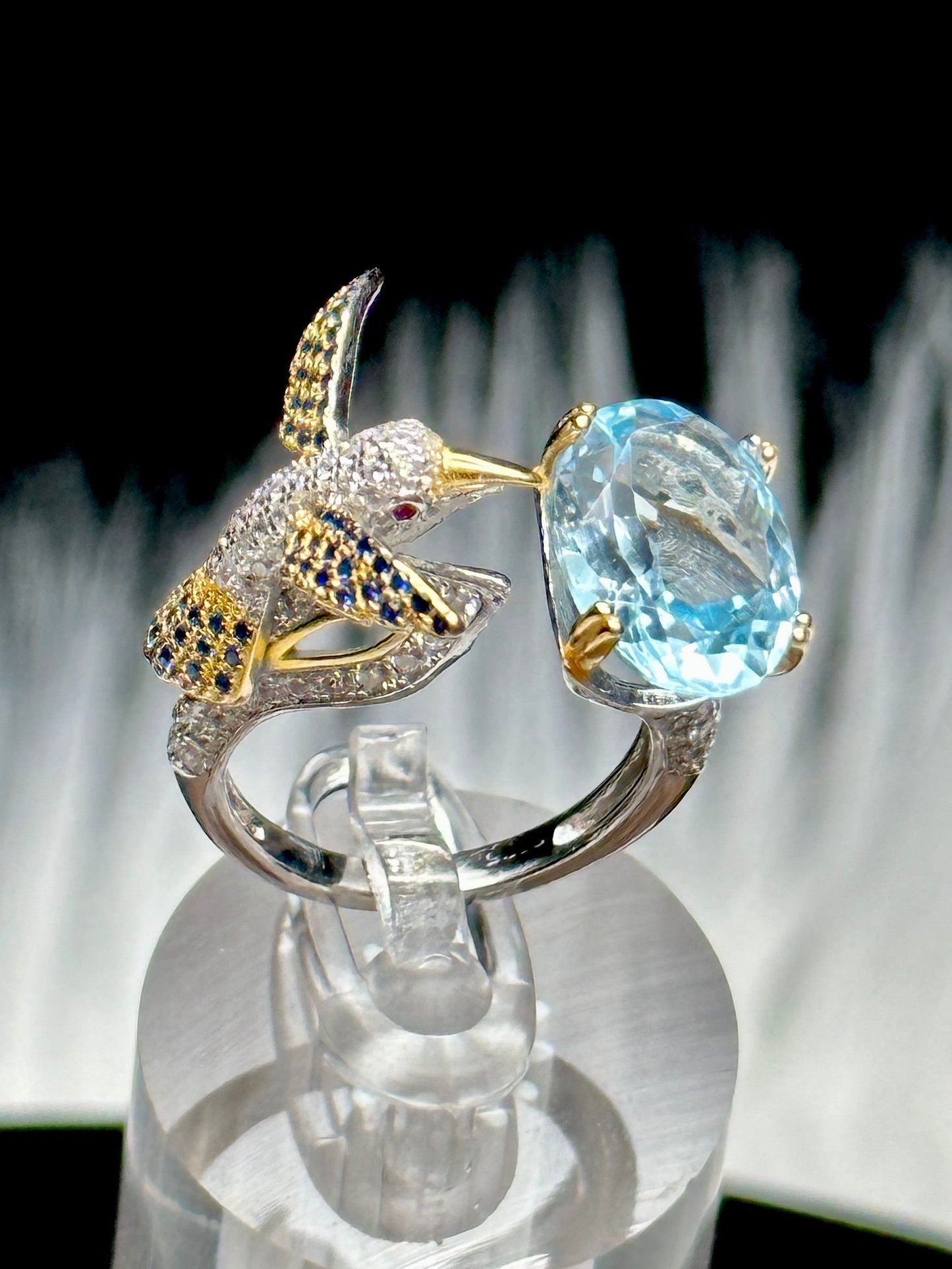 Blue Topaz Ring set in 925 Sterling silver with humming bird design, Adjustable Size