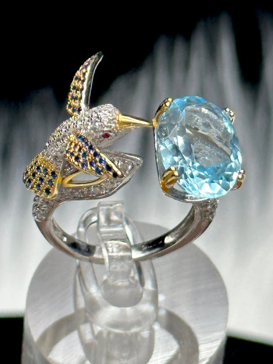 Blue Topaz Ring set in 925 Sterling silver with humming bird design, Adjustable Size