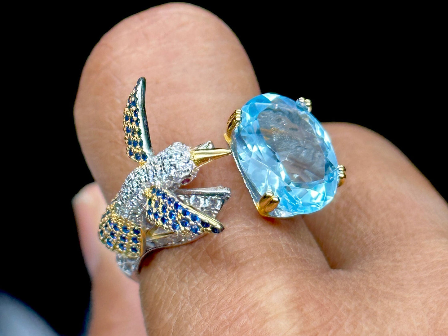 Blue Topaz Ring set in 925 Sterling silver with humming bird design, Adjustable Size